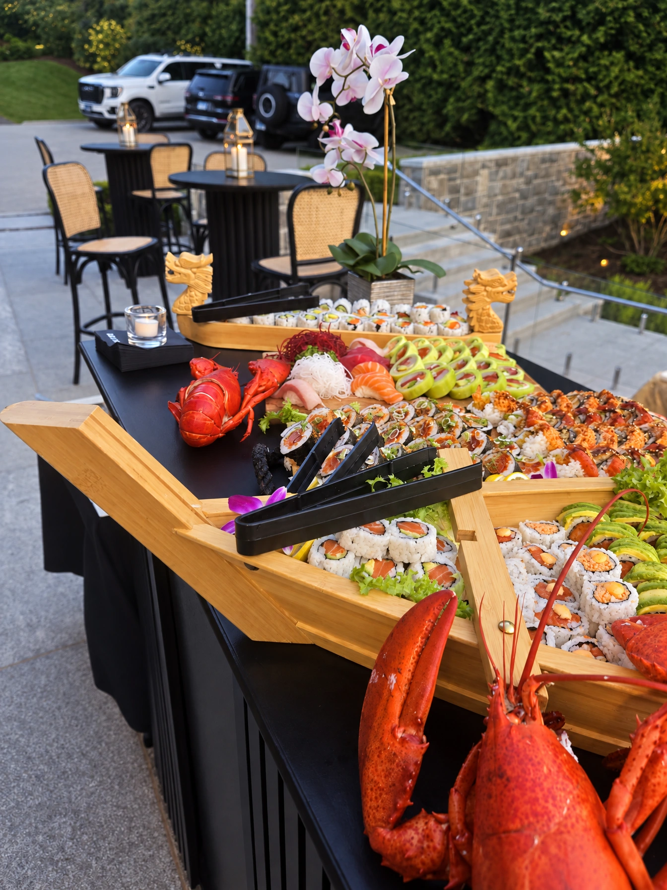 Massive sushi boat with lobster at outdoor event