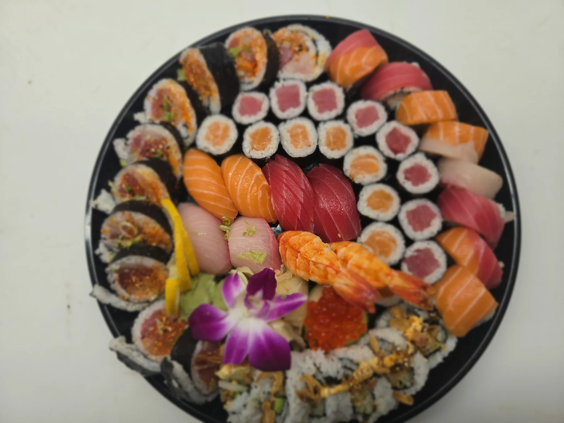 Sushi rolls and nigiri on an ARA NORI platter
